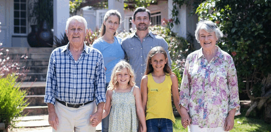 Family standing together outside home